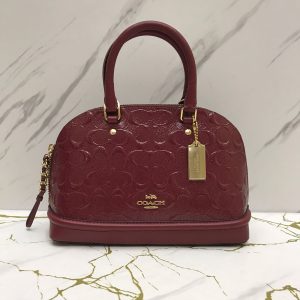 COACH Mini Sierra in Signature Debossed Patent Cherry Leather