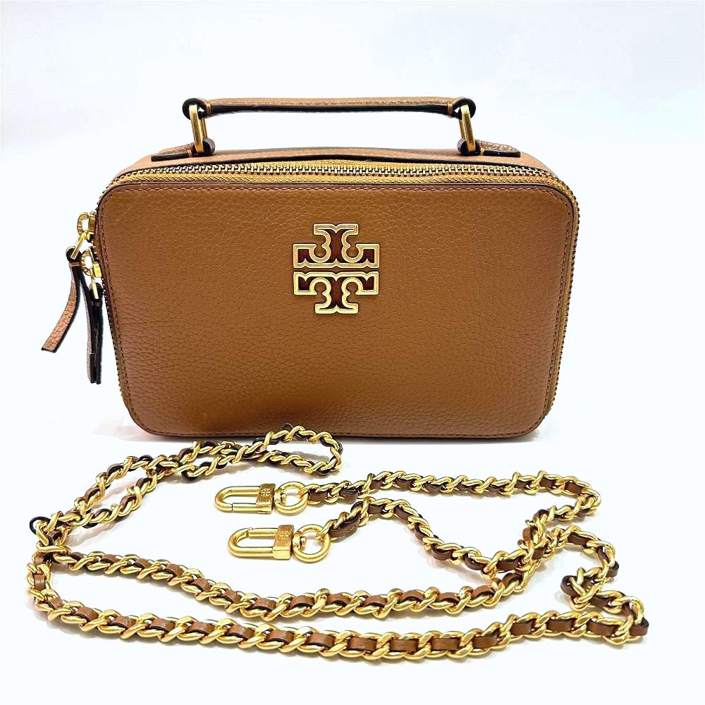 1738061382127_tory_burch_britten_mini_top_handle_case_in_bark_brown_.jpeg